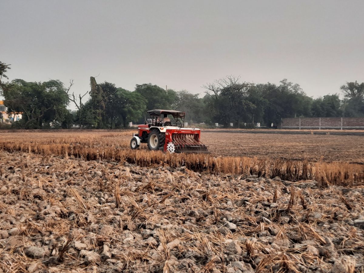 A Happy Seeder and a Super Seeder being used in a field after stubble burning in Punjab’s Sangrur district.