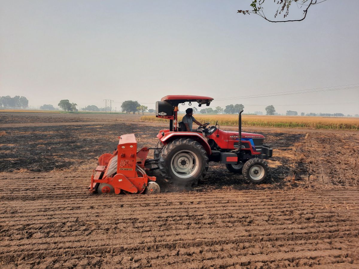 A Happy Seeder and a Super Seeder being used in a field after stubble burning in Punjab’s Sangrur district.