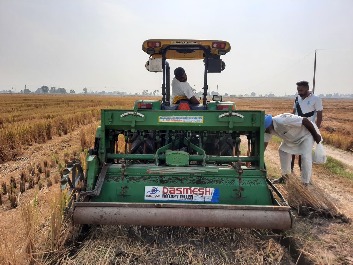 Raspinder Singh’s brother and father demonstrate the functionality of their modified rotavator. 