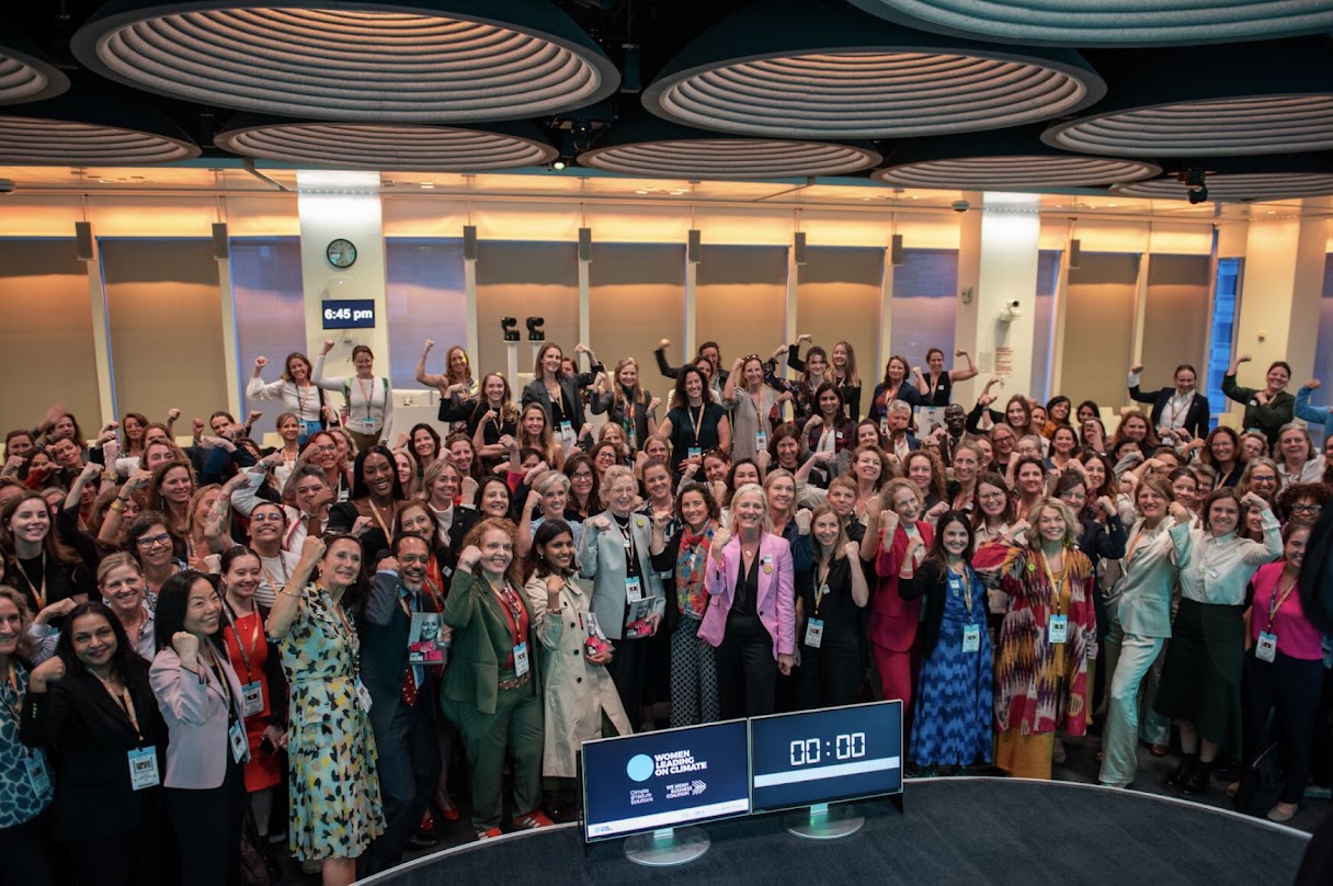 Women leaders on stage at a recognition event