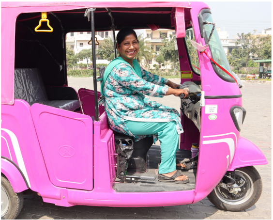 Raj in her pink electric three-wheeler